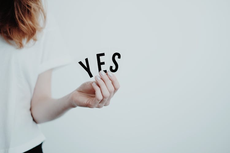 Woman Holding A Yes Sign