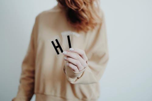 Free Word Hi on Person's Hand Stock Photo