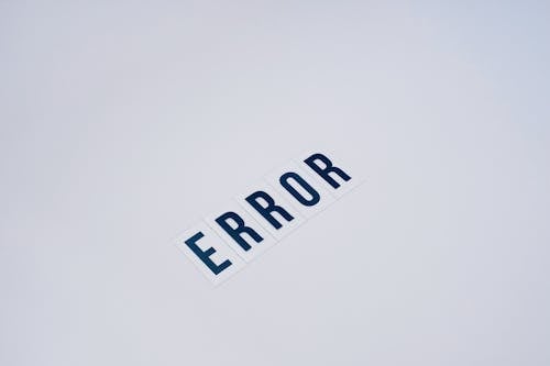 Free Word Error on White Surface Stock Photo