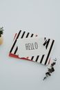 Hello Written on White Paper