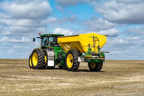 Agricultural machine on rural field in countryside