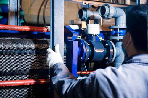 A Person Working with Industrial Machinery