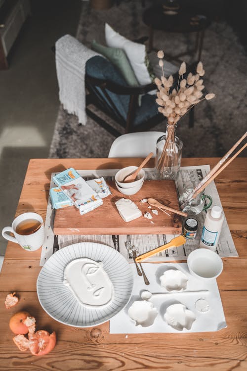 White Ceramic Mug on Brown Wooden Table