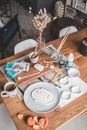 White Ceramic Mug on Brown Wooden Table