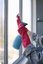 Person Holding Blue Plastic Container