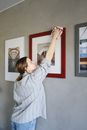 Girl in White and Red Stripe Long Sleeve Shirt Standing Near White Wall