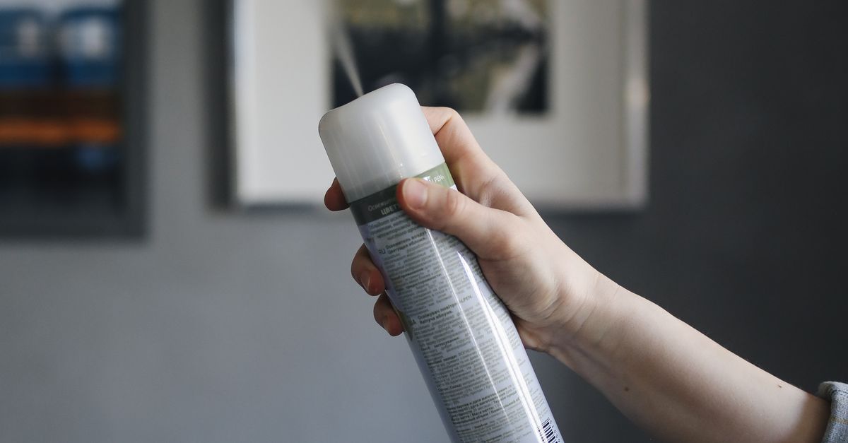 A Person Spraying a Room with a Spray Can · Free Stock Photo