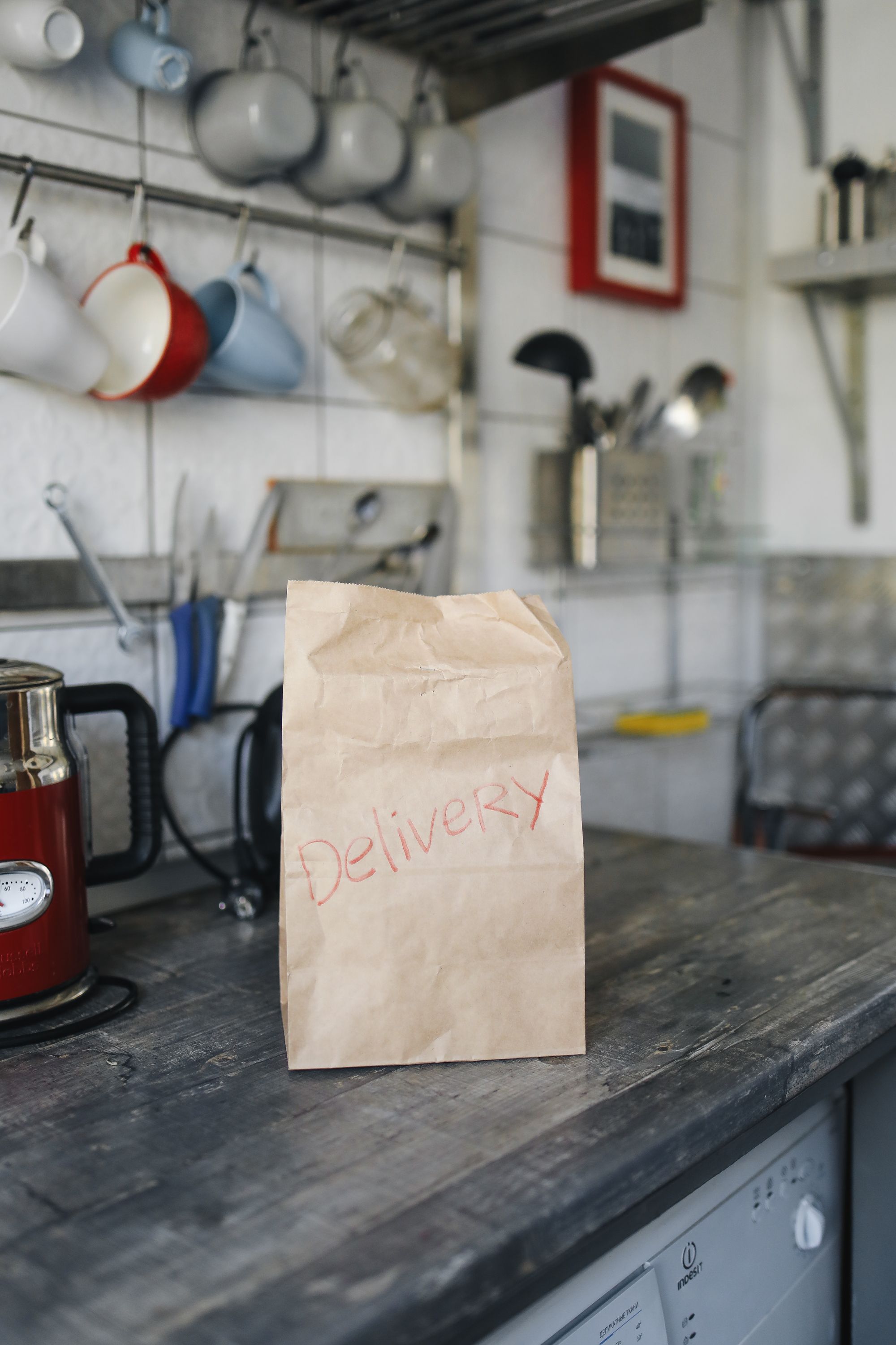 A Brown Paper Bag on Wooden Table · Free Stock Photo