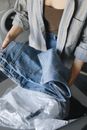 Person in Blue Denim Jacket and White Shirt