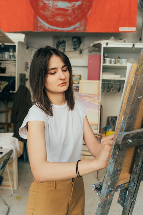 Free A Serious Woman doing Painting  Stock Photo