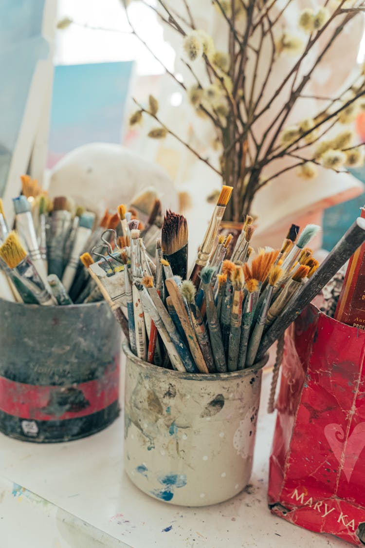 Paint Brushes In Buckets
