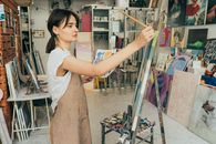A Woman Painting on a Canvas