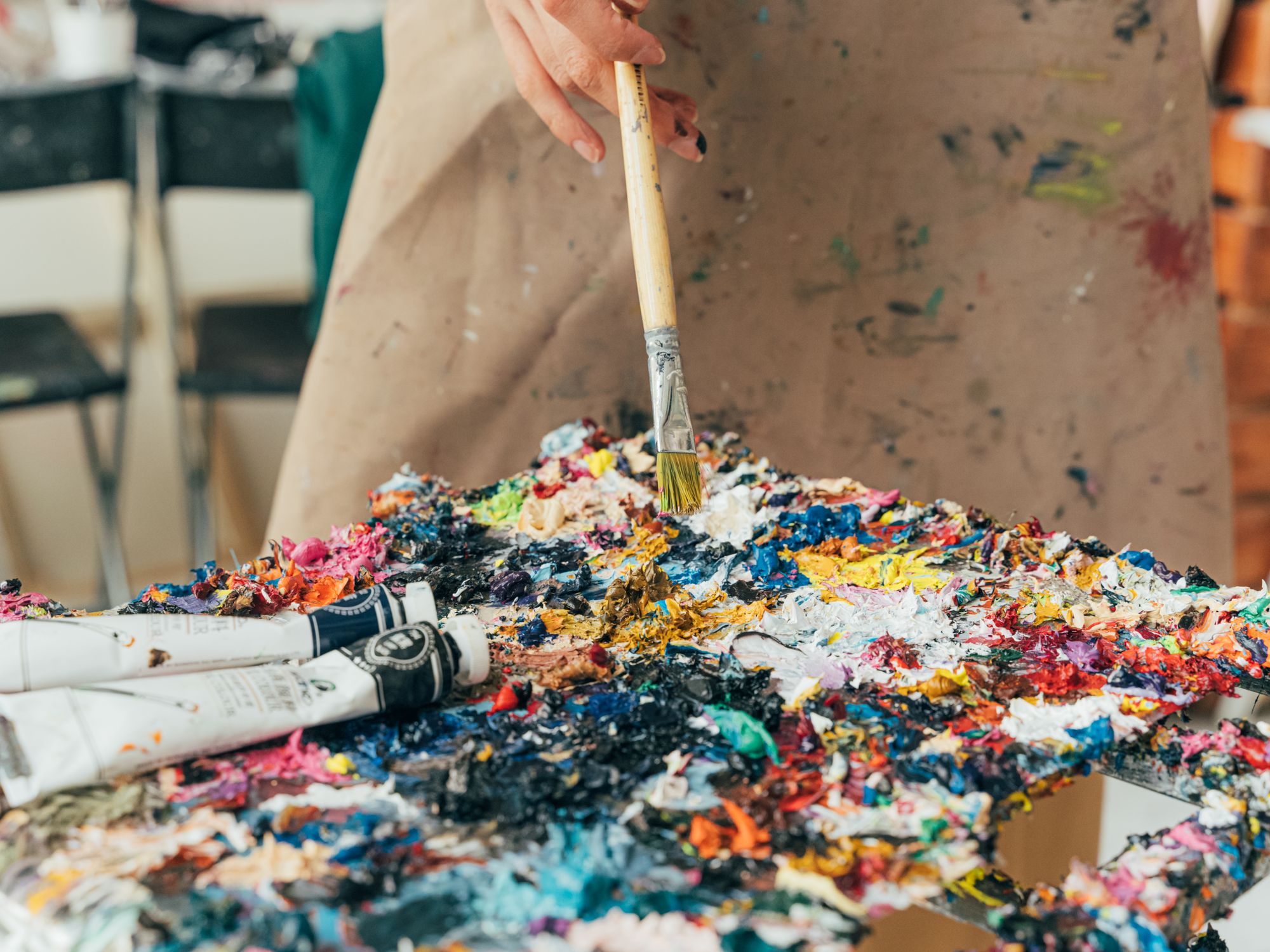 Painters & Decorators in Parsons Green, London — professional decorator painting a wall with a roller