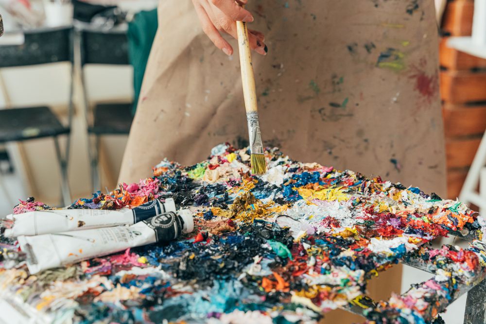 Palette with brushes and paint tubes
