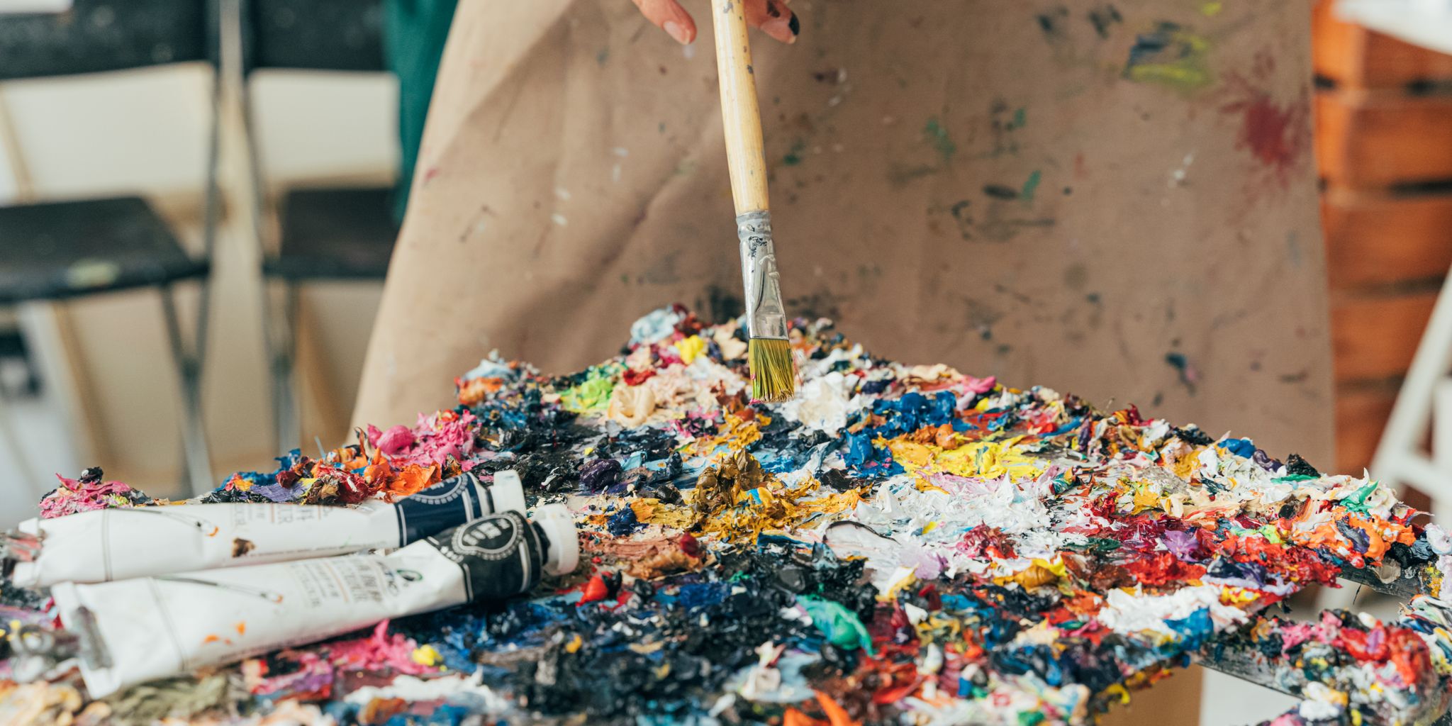 Artist working on a painting in a studio