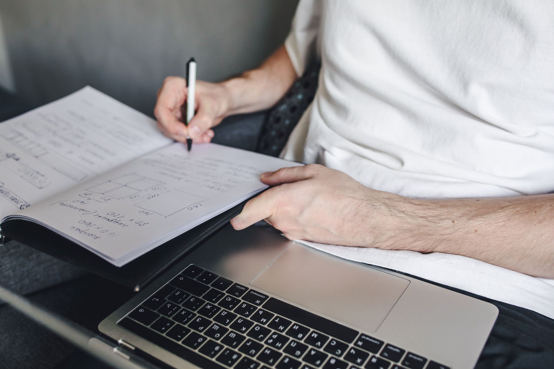 a fantasy football manager studying player projections beside a Premier League fixture calendar