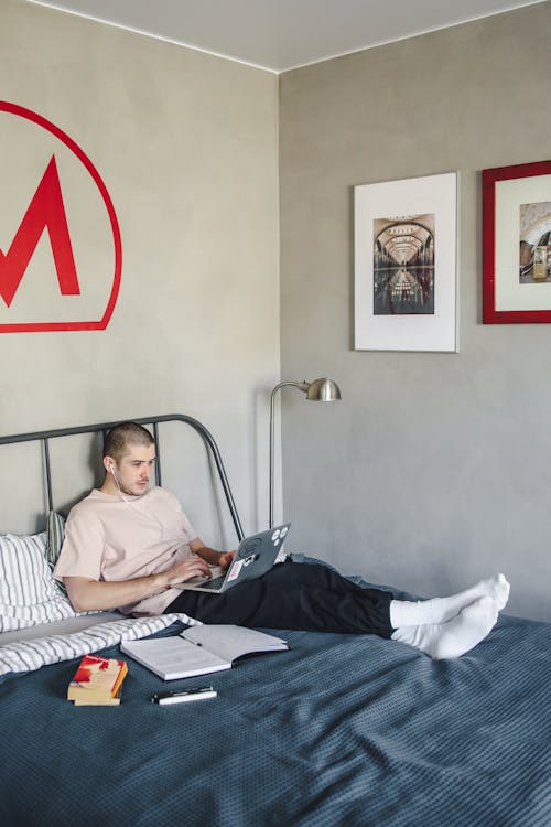 Free A Man Sitting on the Bed Stock Photo