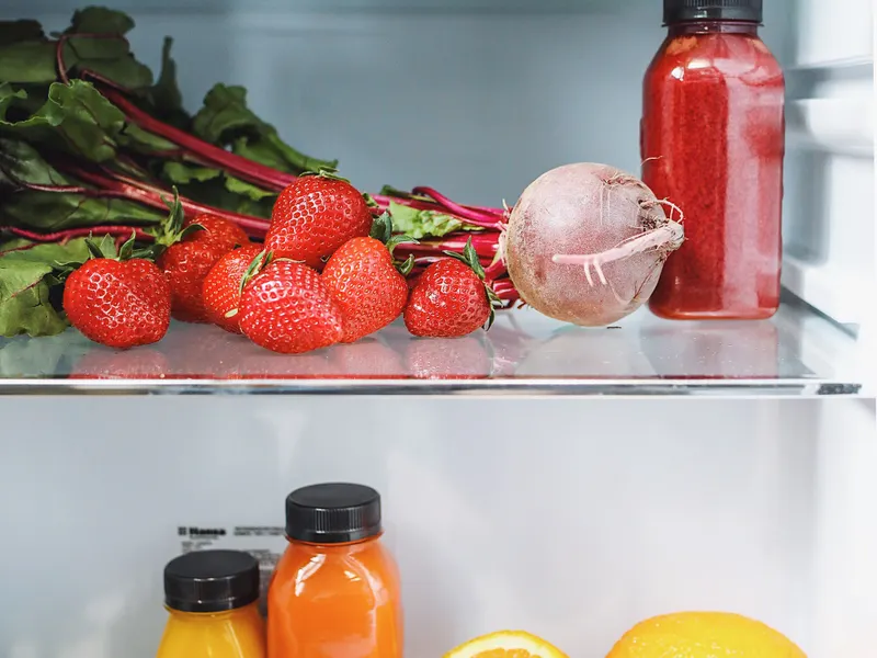Colorful vegetables and juices in a French door refrigerator drawer Colorful vegetables and juices in a French door refrigerator drawer