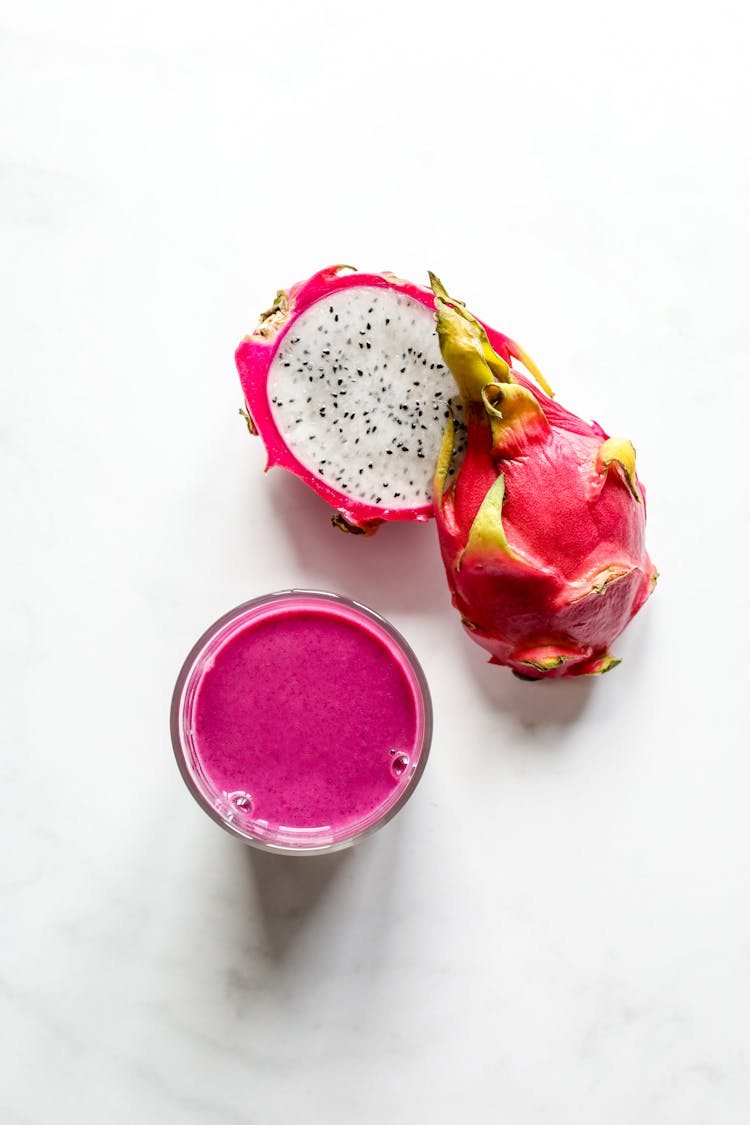 Pink Smoothie In Glass Beside Dragon Fruit