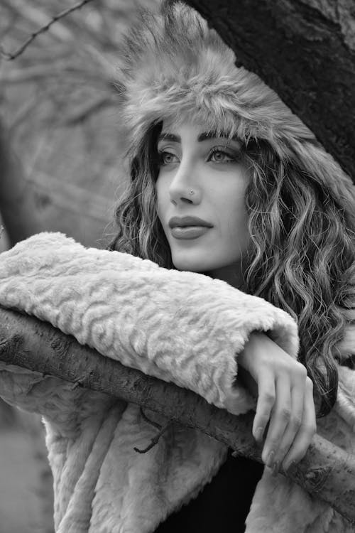 Serene young woman in autumn park