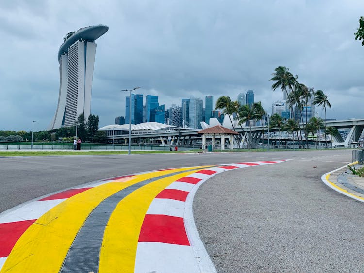 Asphalt Road On Racetrack In Modern City District