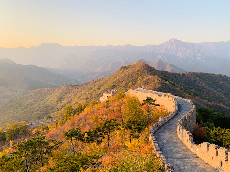 Ancient Stone Wall Going Through Green Hills