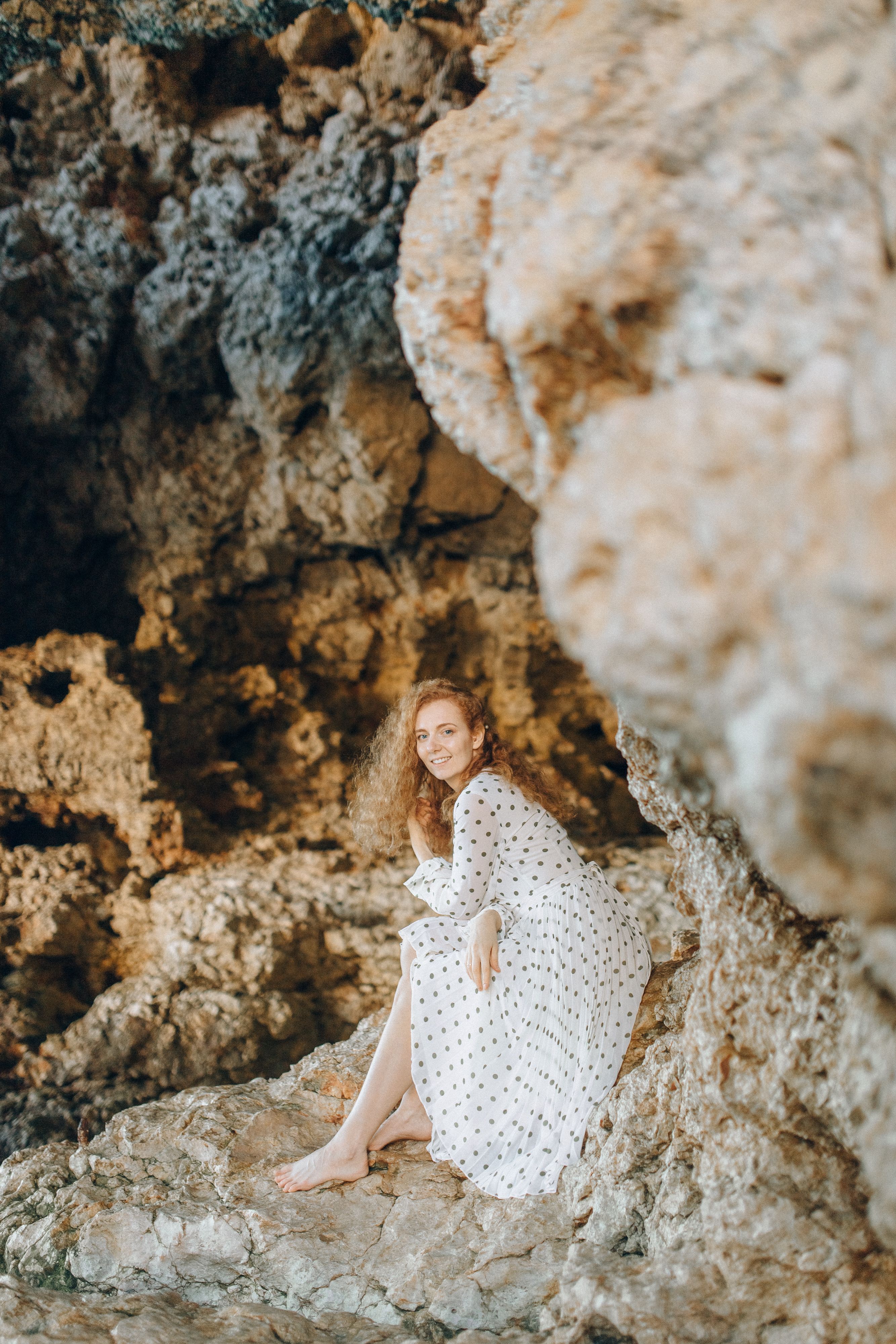 A Woman in White and Black Polka Dot Dress · Free Stock Photo