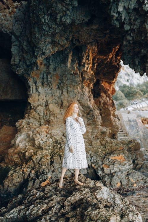 Woman Posing in a Beautiful Macrame Dress white Standing on a Rock · Free  Stock Photo