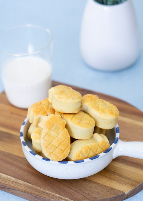 Yellow Cookies on Blue and White Ceramic Bowl