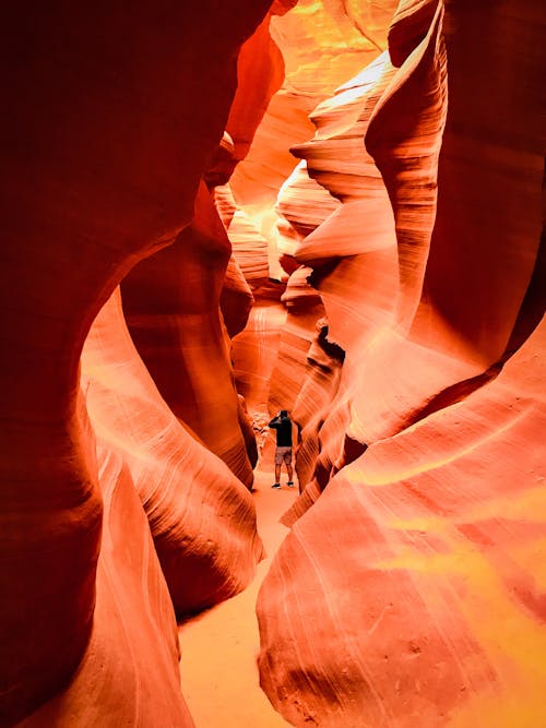 Photo of Person Standing in Antelope Canyon