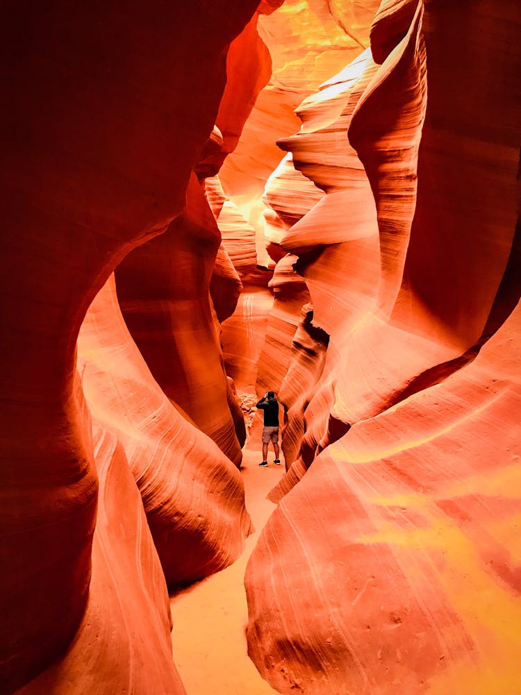 Photo Of Person Standing In Antelope Canyon