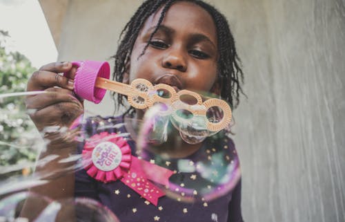 Free Girl Blowing Bubbles Stock Photo