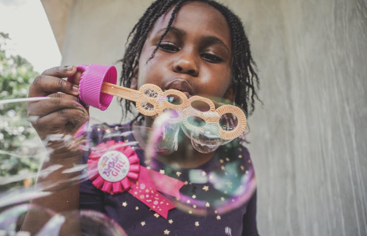 Girl Blowing Bubbles