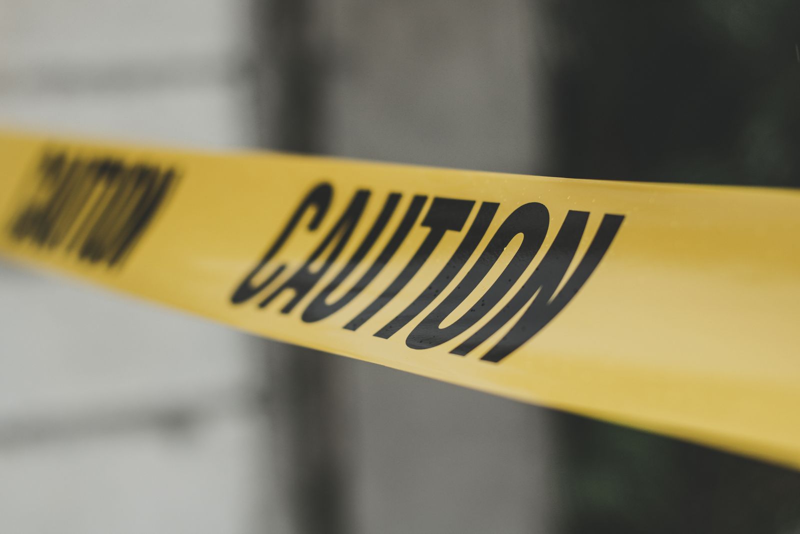 Yellow caution tape stretched across an empty frame