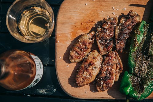 Grilled Meat on Brown Wooden Plate