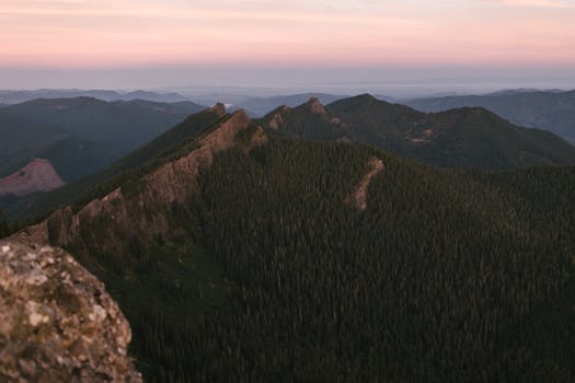 Breathtaking view of a mountain range at sunrise, capturing the natural beauty of Mount Rainier National Park.