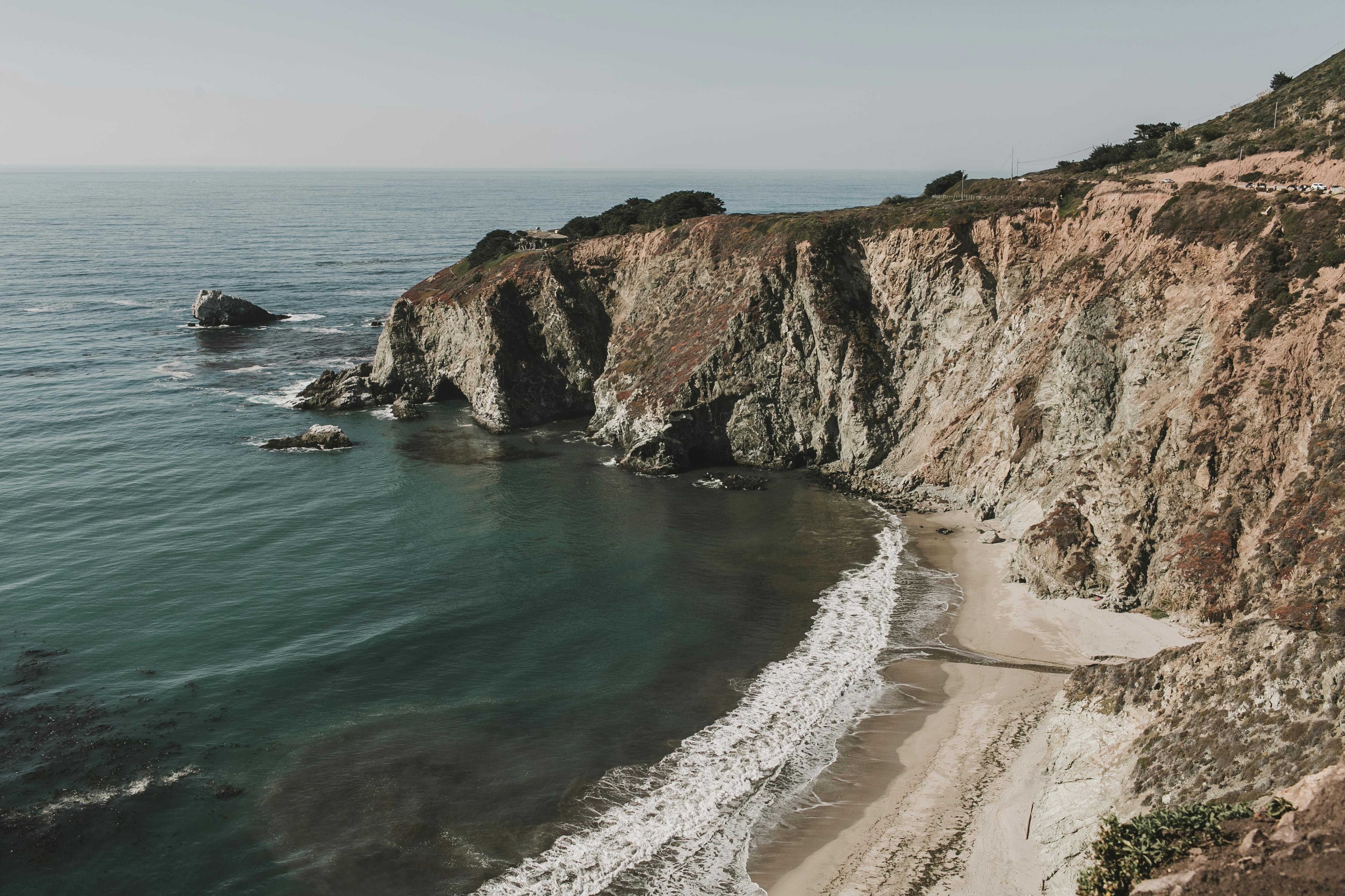 photo of cliff coast near seashore
