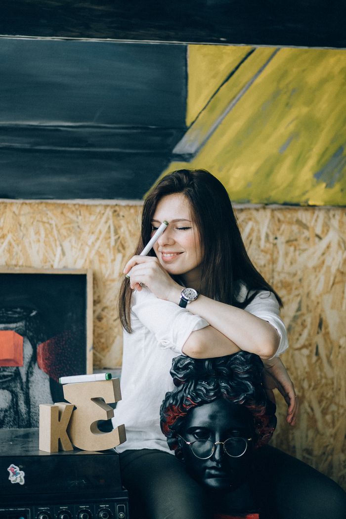 A partner smiling in her studio — photo by Nataliya Vaitkevich on Pexels
