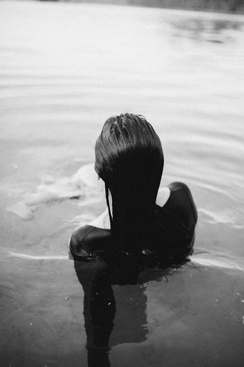 Woman in Water in Grayscale Photography