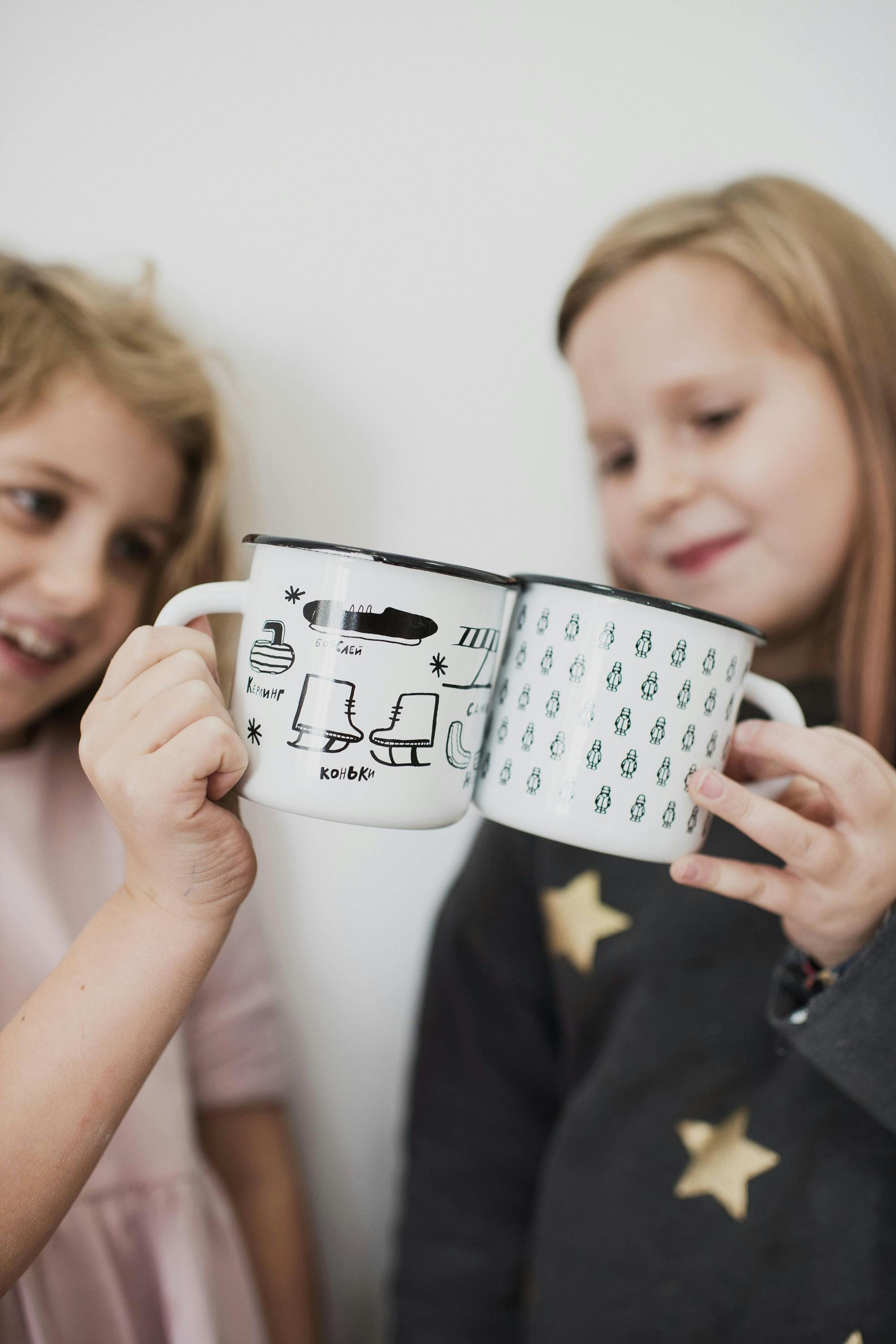 cute little girls toasting with cups