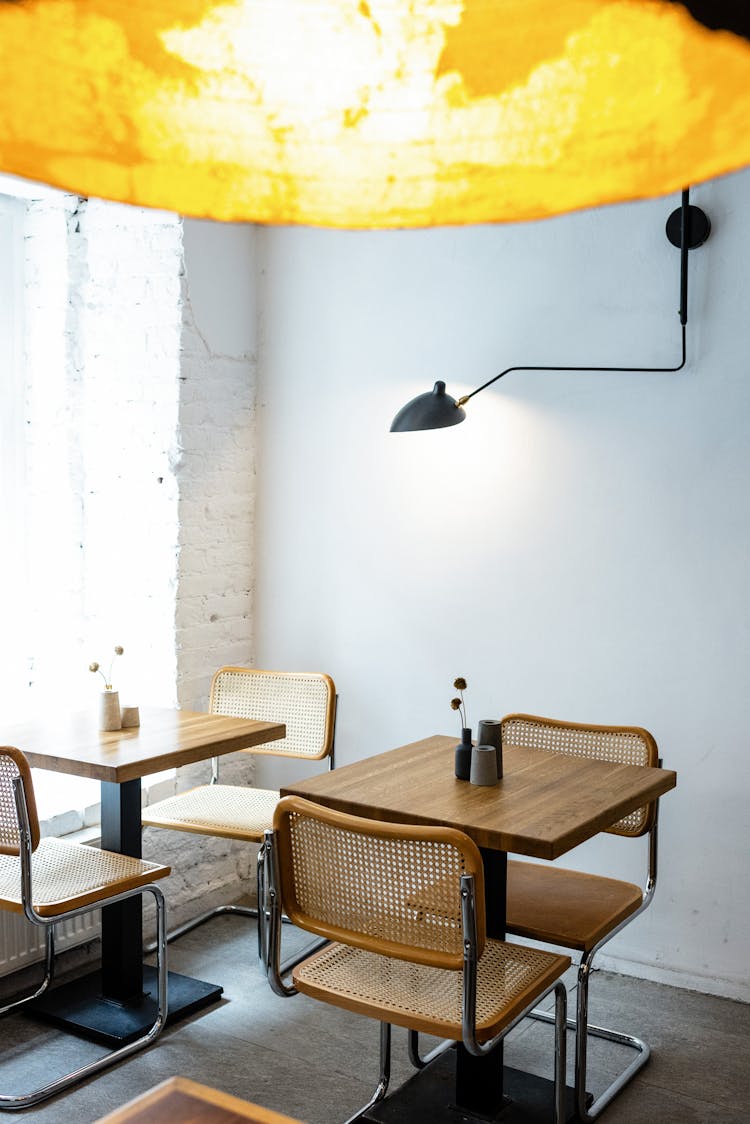 Interior Of Modern Cafe With Stylish Yellow Lamp