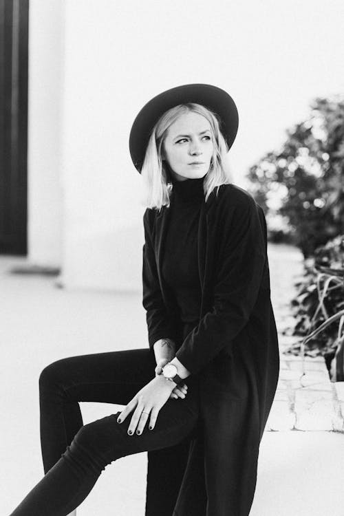 Monochrome Photo of Woman Looking Pensive