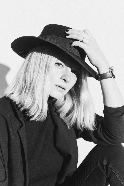 Woman in Black Long Sleeve Shirt Wearing Black Hat · Free Stock Photo