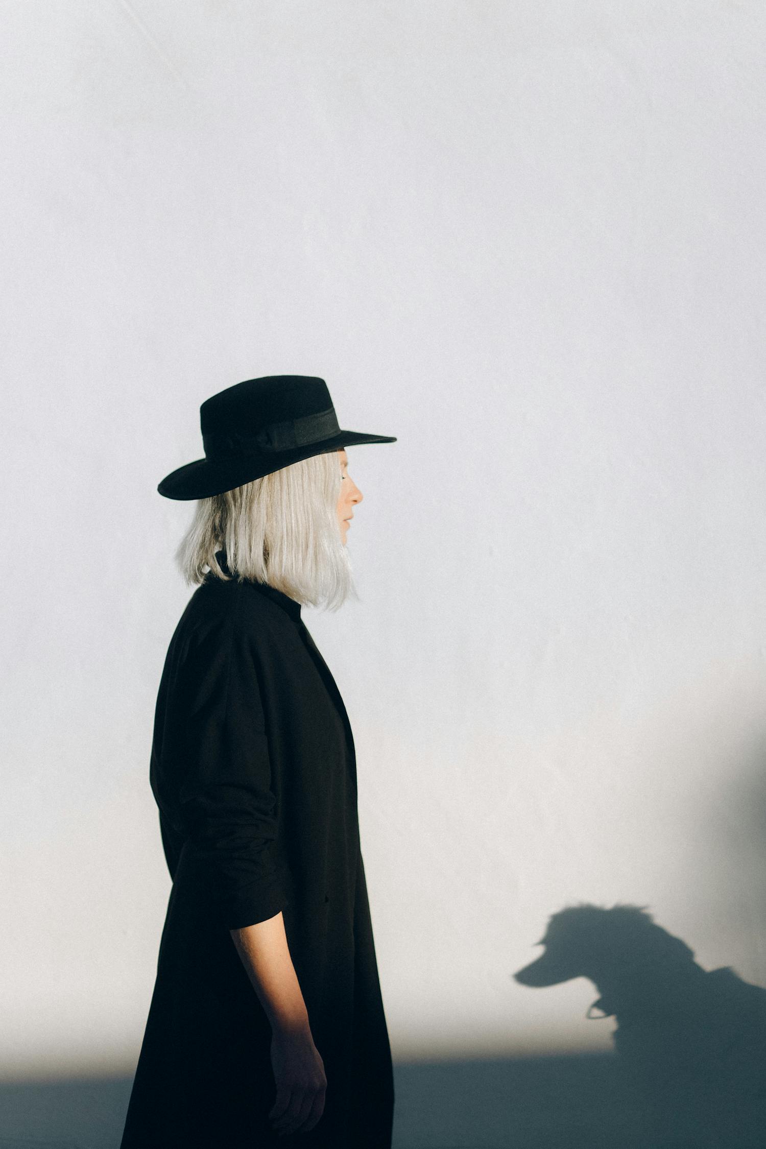 Woman in Black Long Sleeve Shirt and Black Hat
