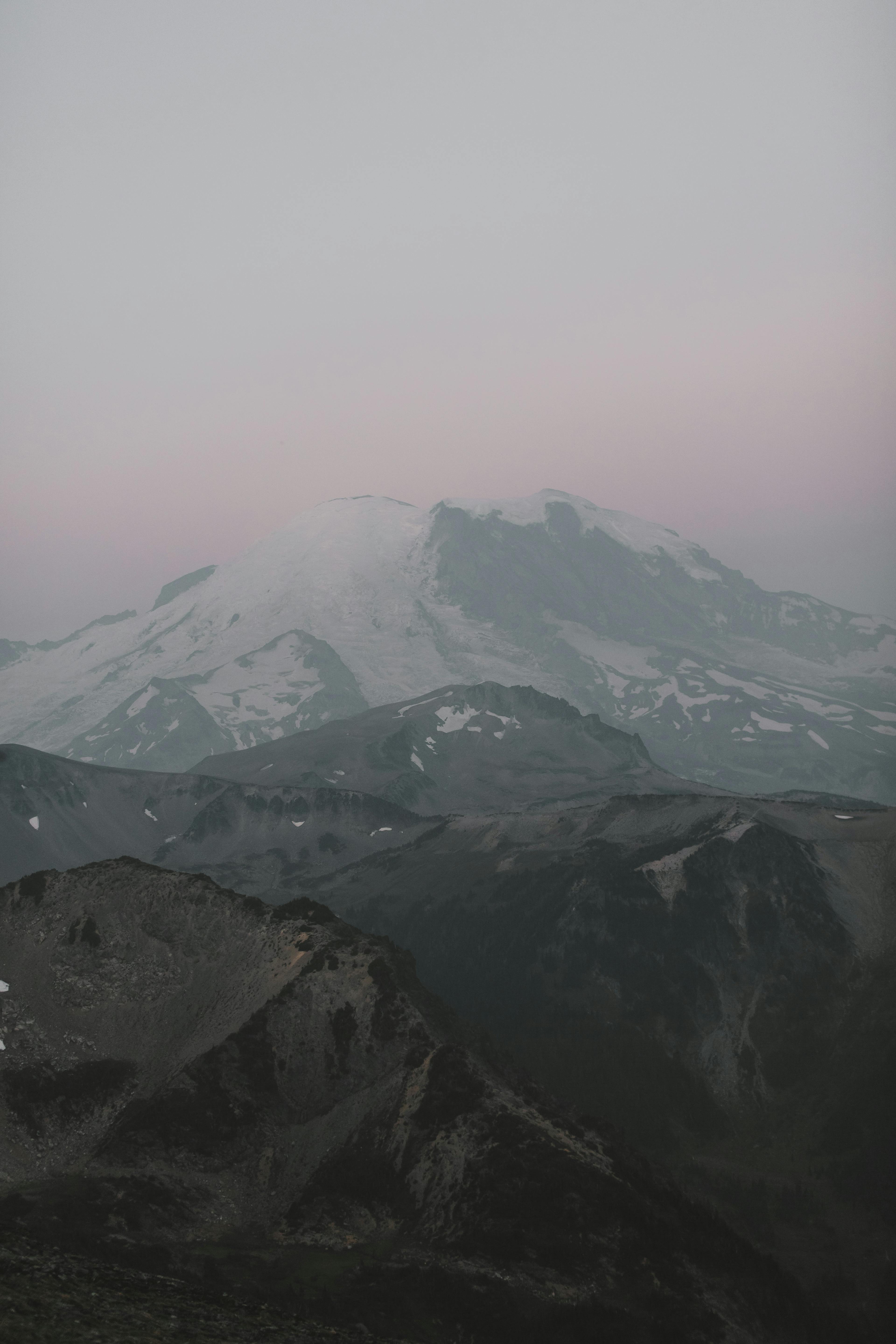 snow capped mountain under the gray sky