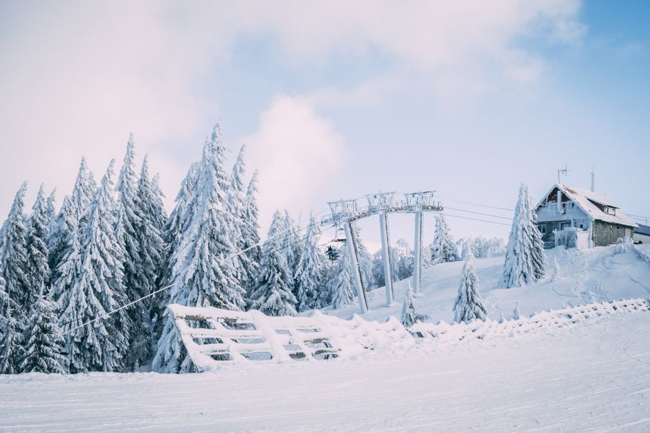 Snow-covered slopes and ski lifts at Kopaonik mountain resort in Serbia