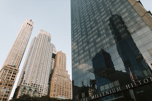A low angle shot of New York City's skyline featuring towering skyscrapers at dusk.