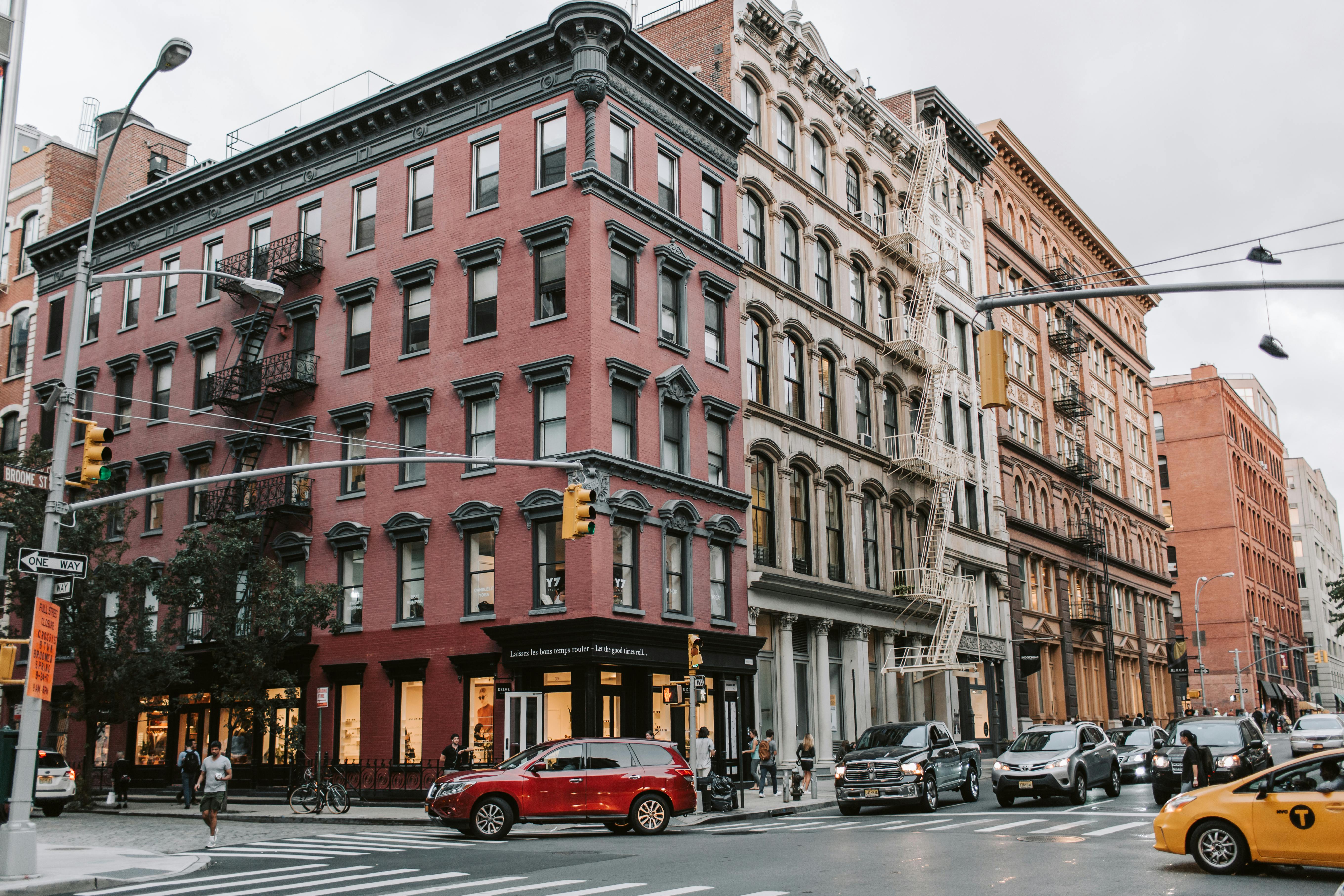 traffic on new york city street beside buildings