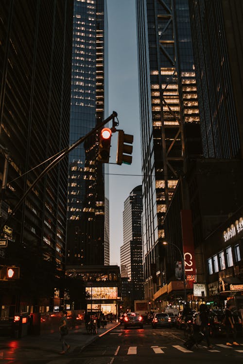 Street Between Skyscrapers During Night Time