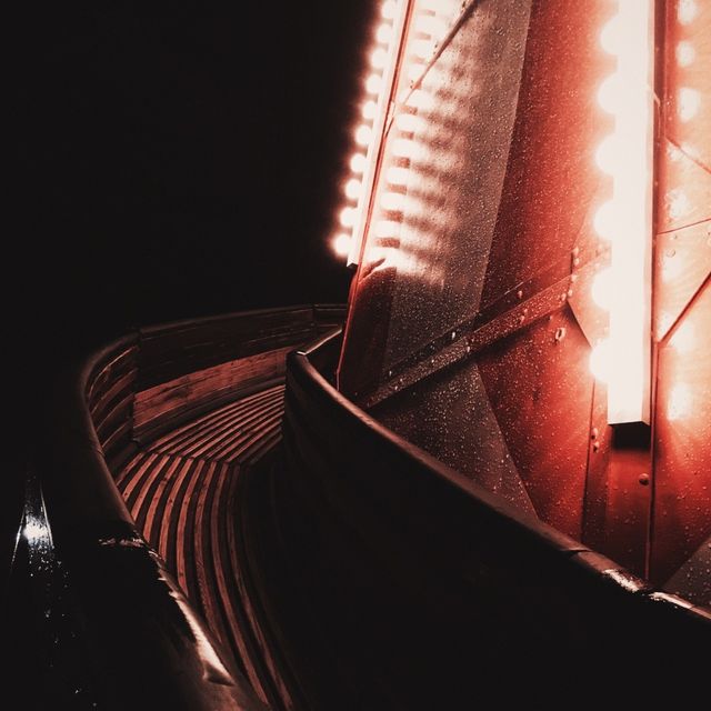 Red-lit walkway at night — photo by Stacey Koenitz on Pexels
